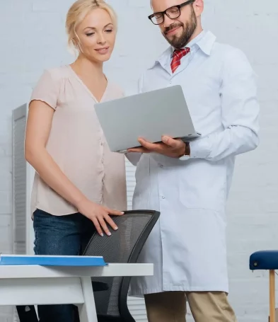 smiling-physiotherapist-in-white-coat-and-female-p-2022-11-01-23-18-06-utc-min-min